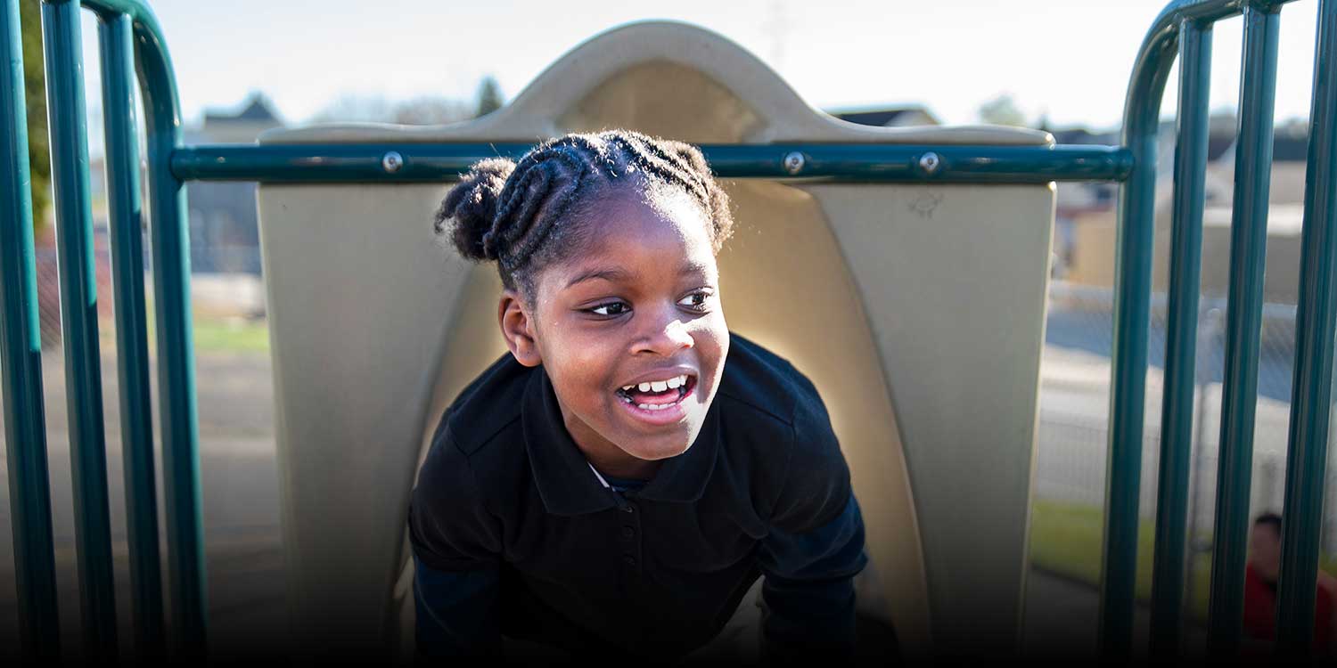 A student playing at the playground