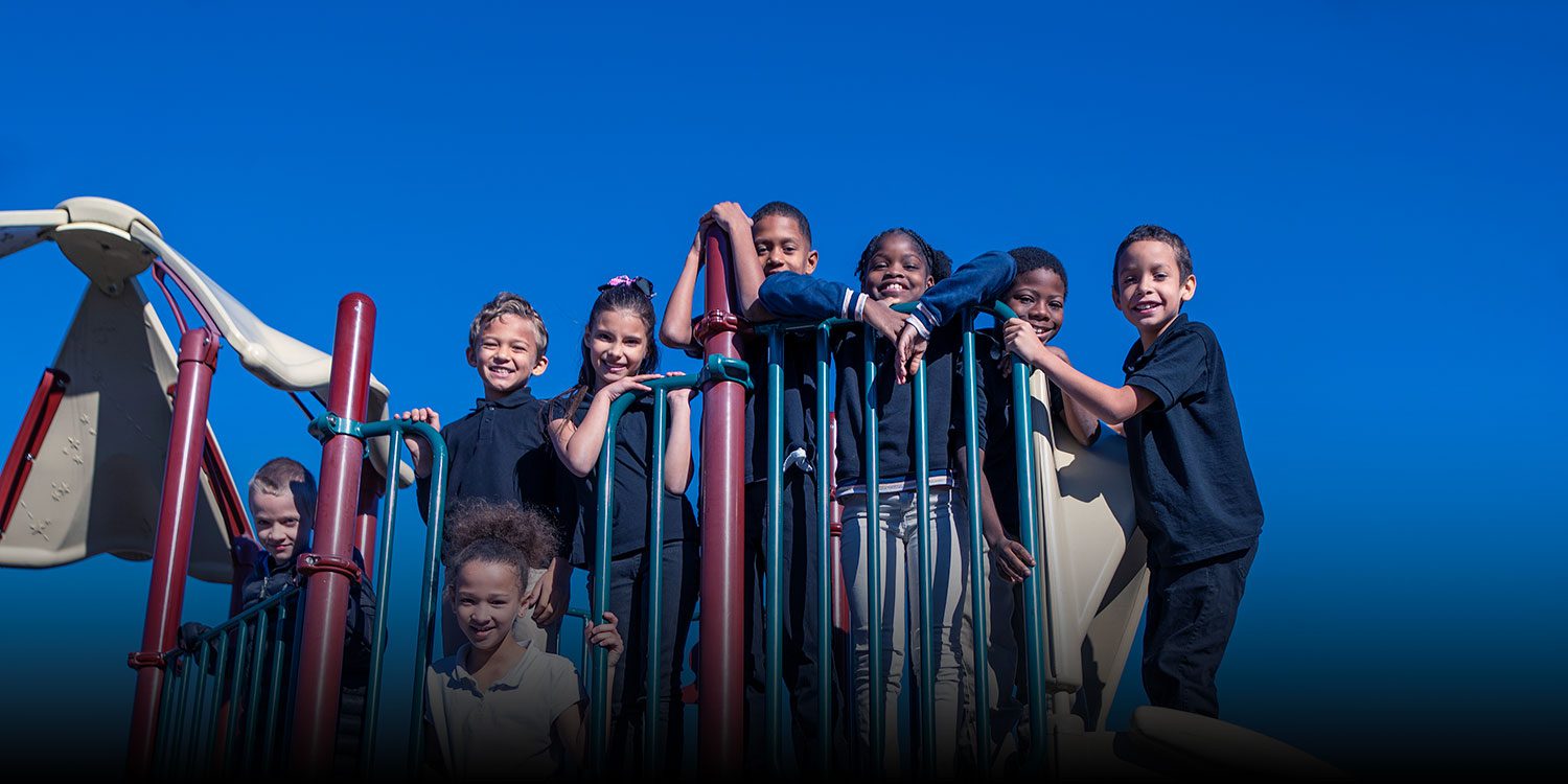 Group of smiling students at the playground